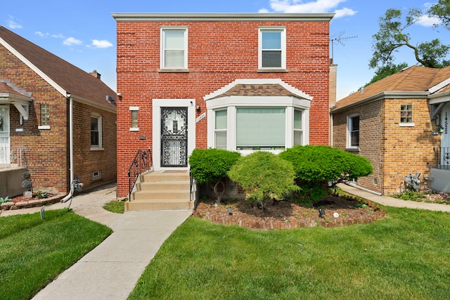 14524 S Lowe Ave, Riverdale, IL 60827 - view of front of property with a front lawn and brick siding
