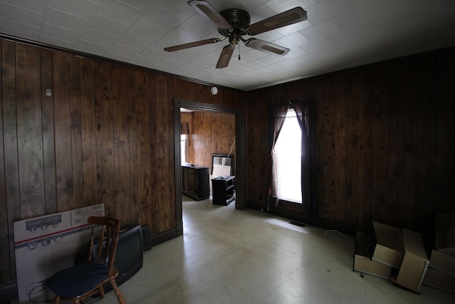 940 S Washington Ave, Kankakee, IL 60901 - home office featuring wood walls, a ceiling fan, and light floors