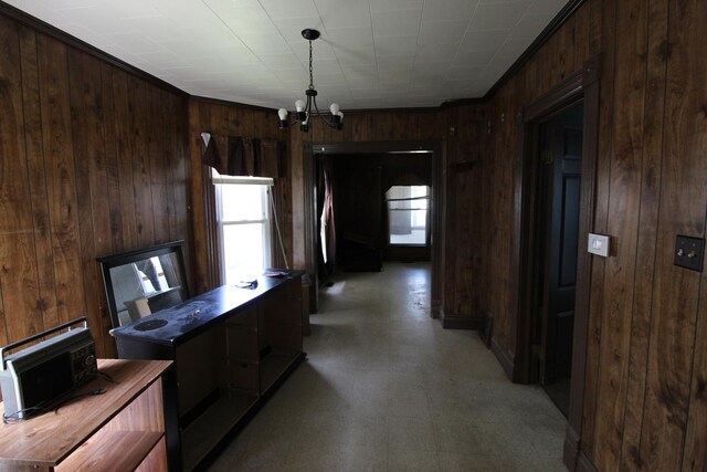 940 S Washington Ave, Kankakee, IL 60901 - kitchen with wood walls, a chandelier, light floors, modern cabinets, and dark brown cabinets
