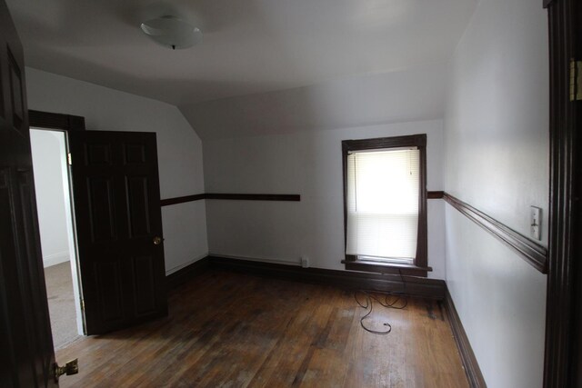 940 S Washington Ave, Kankakee, IL 60901 - unfurnished room featuring vaulted ceiling and wood finished floors