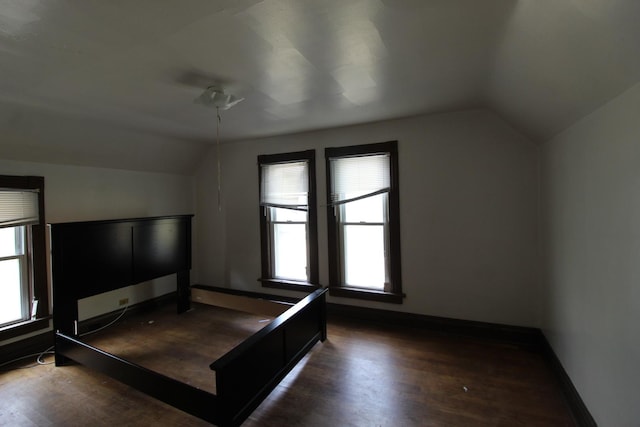 940 S Washington Ave, Kankakee, IL 60901 - unfurnished bedroom featuring lofted ceiling and wood finished floors