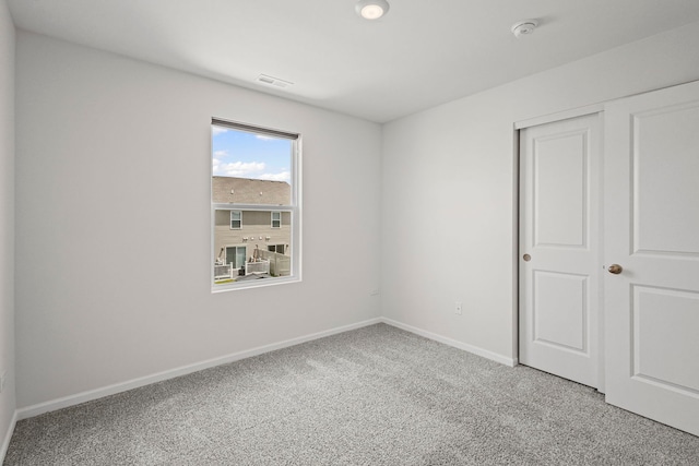 319 Brickyard Ct, Joliet, IL 60436 - unfurnished bedroom with light colored carpet and a closet