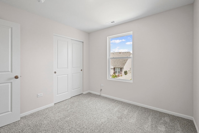 319 Brickyard Ct, Joliet, IL 60436 - unfurnished bedroom featuring carpet flooring and a closet