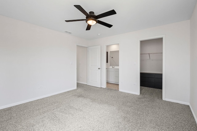 319 Brickyard Ct, Joliet, IL 60436 - unfurnished bedroom featuring carpet floors, a walk in closet, a closet, ensuite bathroom, and ceiling fan
