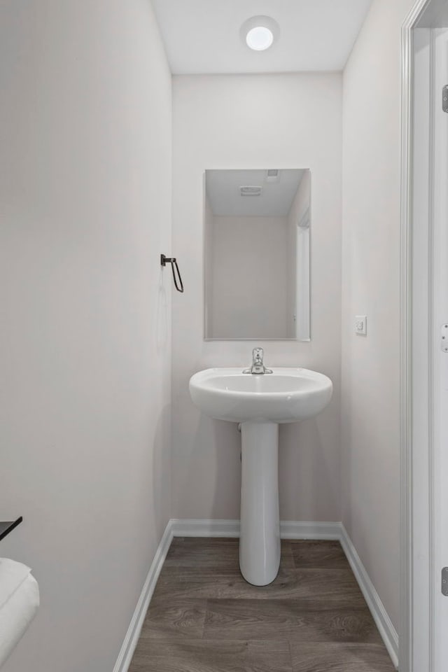 319 Brickyard Ct, Joliet, IL 60436 - bathroom featuring baseboards and wood finished floors
