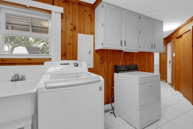 8201 Paloma Dr, Orland Park, IL 60462 - laundry room featuring electric panel, separate washer and dryer, wood walls, cabinet space, and light tile patterned floors