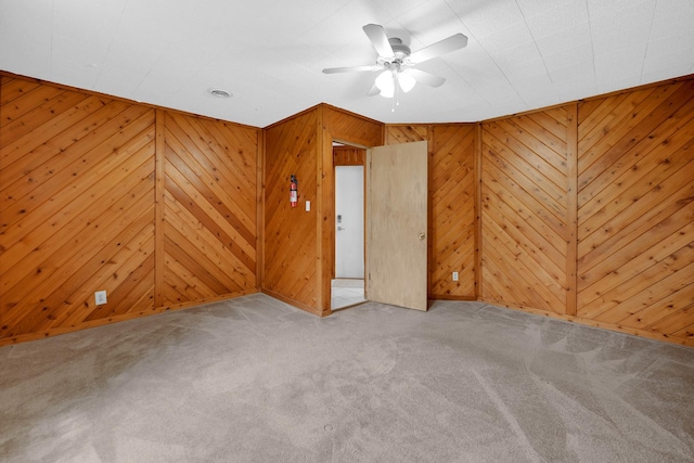 8201 Paloma Dr, Orland Park, IL 60462 - carpeted spare room featuring a ceiling fan and wooden walls