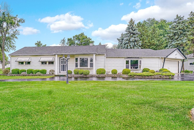 8201 Paloma Dr, Orland Park, IL 60462 - view of front of house with a front yard, an attached garage, a chimney, and a shingled roof