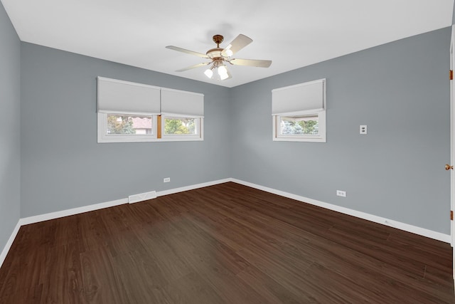 8201 Paloma Dr, Orland Park, IL 60462 - unfurnished room with healthy amount of natural light, dark wood-style floors, and ceiling fan