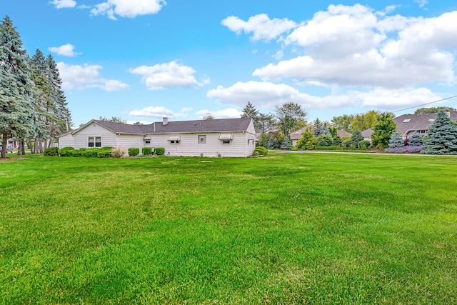 8201 Paloma Dr, Orland Park, IL 60462 - rear view of house with a lawn