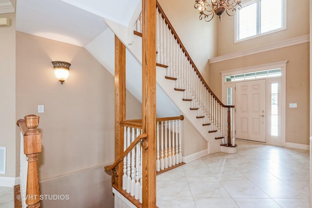 1803 Rizzi Ln, Bartlett, IL 60103 - entryway featuring a chandelier, stairs, and a towering ceiling