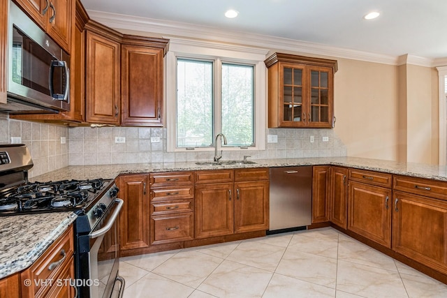 1803 Rizzi Ln, Bartlett, IL 60103 - kitchen with stainless steel appliances, brown cabinets, light stone counters, decorative backsplash, and ornamental molding