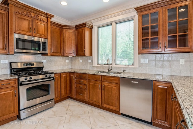 1803 Rizzi Ln, Bartlett, IL 60103 - kitchen with appliances with stainless steel finishes, brown cabinetry, light stone countertops, ornamental molding, and glass insert cabinets