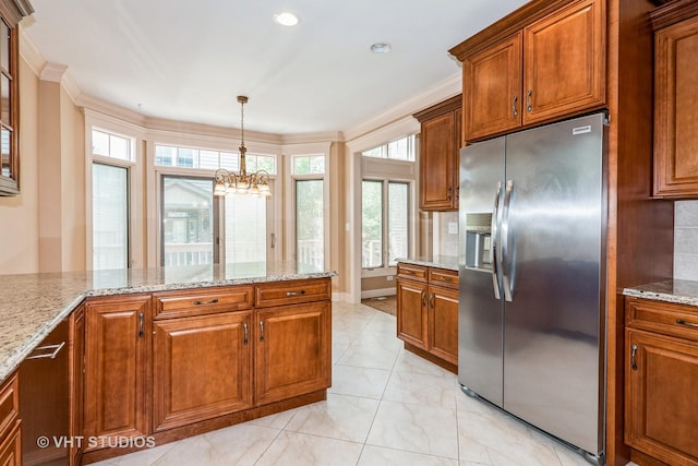 1803 Rizzi Ln, Bartlett, IL 60103 - kitchen with stainless steel fridge with ice dispenser, brown cabinetry, a chandelier, light stone countertops, and hanging light fixtures