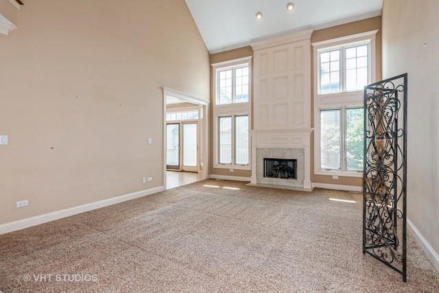 1803 Rizzi Ln, Bartlett, IL 60103 - unfurnished living room featuring high vaulted ceiling, healthy amount of natural light, carpet flooring, a high end fireplace, and recessed lighting