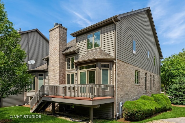 1803 Rizzi Ln, Bartlett, IL 60103 - back of house featuring a chimney, a wooden deck, brick siding, and roof with shingles