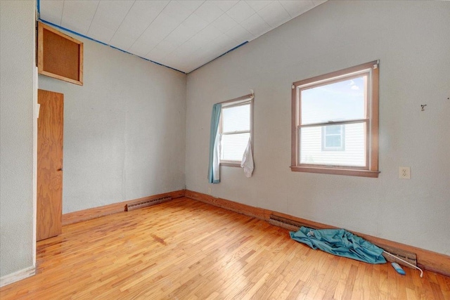 302 S Leney St, Ogden, IL 61859 - spare room with wood finished floors and baseboards