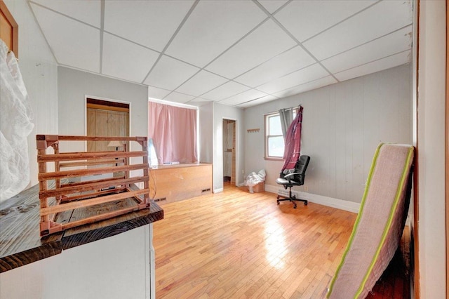 302 S Leney St, Ogden, IL 61859 - unfurnished bedroom featuring wood finished floors and a paneled ceiling
