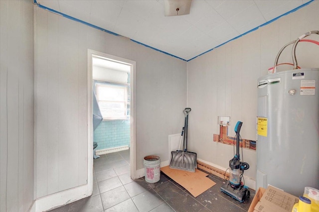 302 S Leney St, Ogden, IL 61859 - workout room featuring electric water heater and tile patterned floors