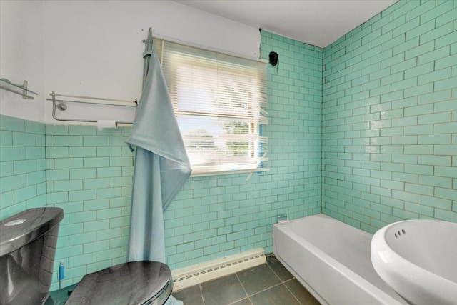 302 S Leney St, Ogden, IL 61859 - full bath with tile walls, a baseboard heating unit, tile patterned flooring, and a bathtub