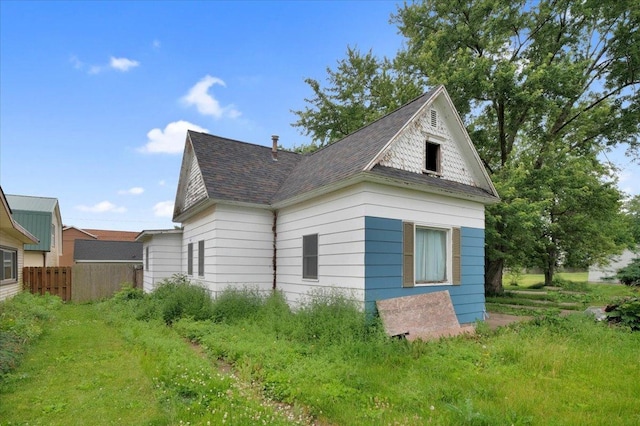 302 S Leney St, Ogden, IL 61859 - view of property exterior featuring roof with shingles