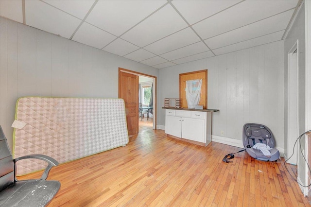 302 S Leney St, Ogden, IL 61859 - sitting room with a drop ceiling, light wood-style floors, and wood walls