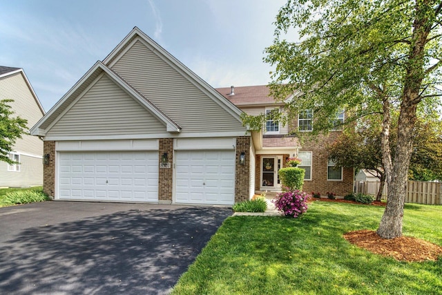 8307 Newbridge Ct, Joliet, IL 60431 - traditional-style house with brick siding, asphalt driveway, and a garage