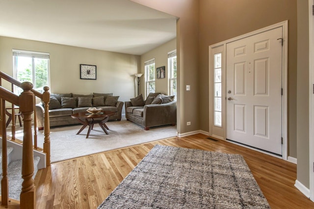 8307 Newbridge Ct, Joliet, IL 60431 - entryway with healthy amount of natural light, wood finished floors, and stairs