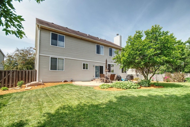 8307 Newbridge Ct, Joliet, IL 60431 - rear view of house with a patio, a fenced backyard, and a chimney
