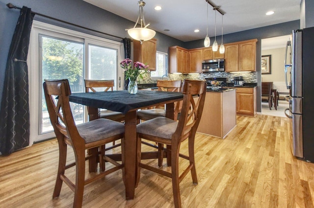 8307 Newbridge Ct, Joliet, IL 60431 - dining space with light wood-style flooring and recessed lighting