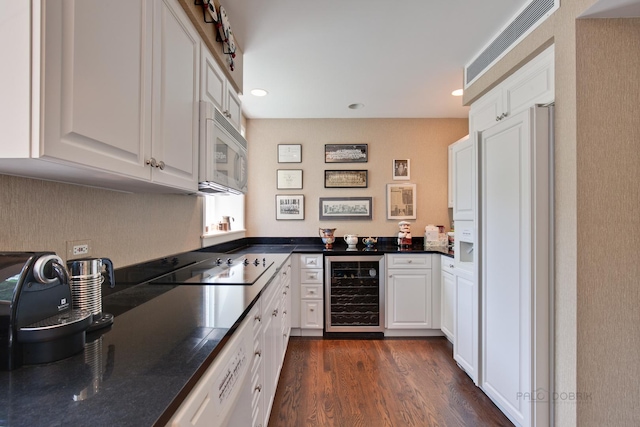 531 N Mayflower Rd Unit 531, Lake Forest, IL 60045 - kitchen with wine cooler, white microwave, dark countertops, high end fridge, and white cabinetry