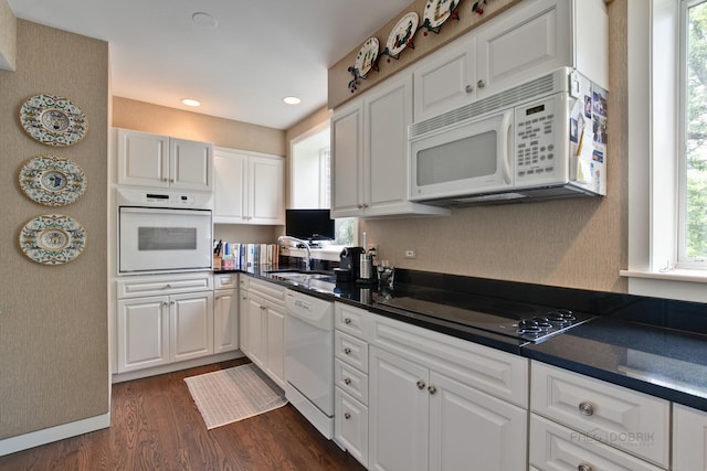 531 N Mayflower Rd Unit 531, Lake Forest, IL 60045 - kitchen featuring white appliances, dark countertops, dark wood-style floors, white cabinetry, and recessed lighting