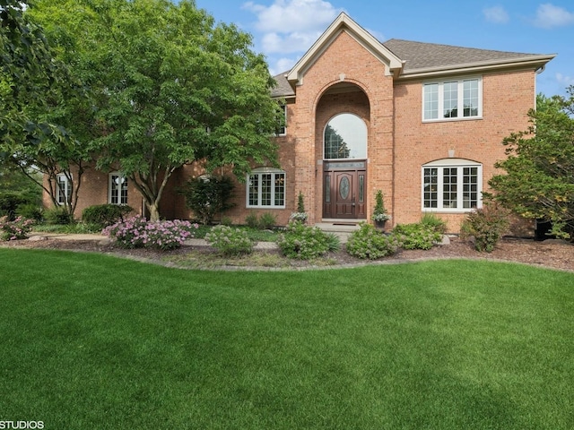 25397 N Northbridge Rd, Hawthorn Woods, IL 60047 - view of front of home featuring brick siding, a front lawn, and a shingled roof