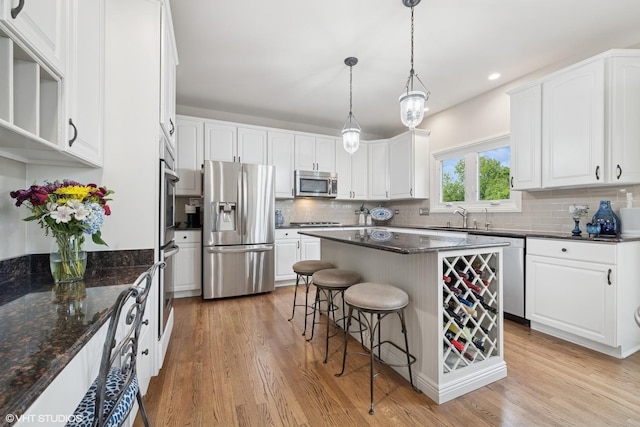 25397 N Northbridge Rd, Hawthorn Woods, IL 60047 - kitchen with appliances with stainless steel finishes, a breakfast bar area, white cabinets, and recessed lighting