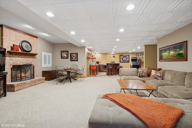 25397 N Northbridge Rd, Hawthorn Woods, IL 60047 - living room with recessed lighting, bar area, a brick fireplace, carpet floors, and an ornate ceiling