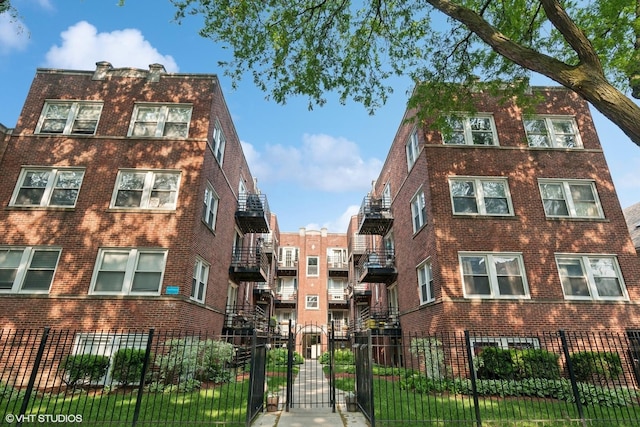 4332 N Sacramento Ave Unit 3S, Chicago, IL 60618 - view of apartment building / complex with a fenced front yard