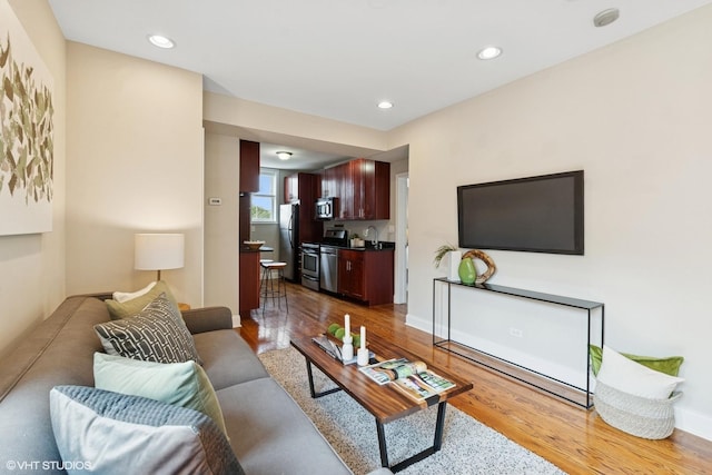 4332 N Sacramento Ave Unit 3S, Chicago, IL 60618 - living room with wood finished floors and recessed lighting