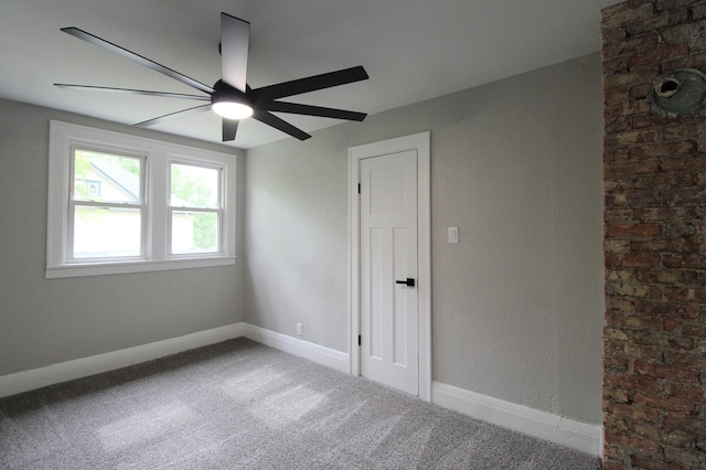 957 E Eagle St, Kankakee, IL 60901 - carpeted spare room featuring a ceiling fan and baseboards