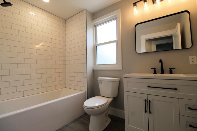 957 E Eagle St, Kankakee, IL 60901 - full bathroom featuring vanity, wood finished floors, and washtub / shower combination