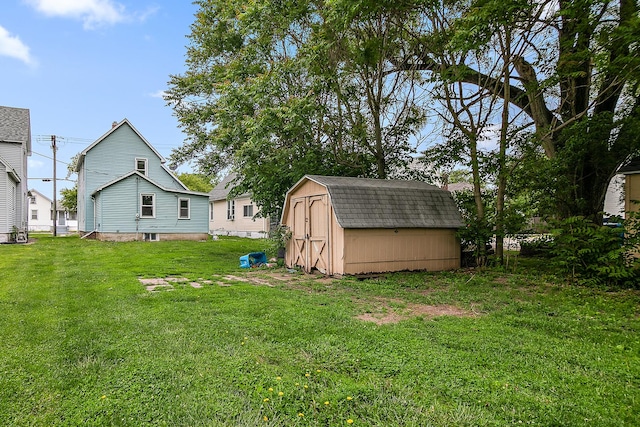 554 W Station St, Kankakee, IL 60901 - view of green lawn featuring a storage unit