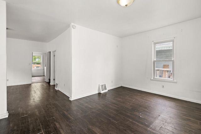 554 W Station St, Kankakee, IL 60901 - unfurnished room with dark wood-type flooring and baseboards