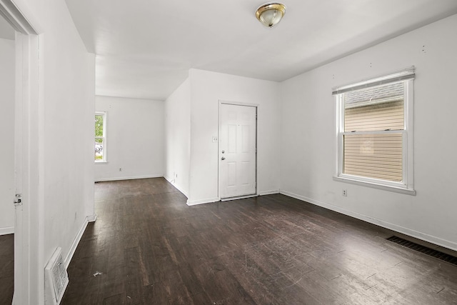 554 W Station St, Kankakee, IL 60901 - unfurnished room featuring dark wood finished floors and baseboards