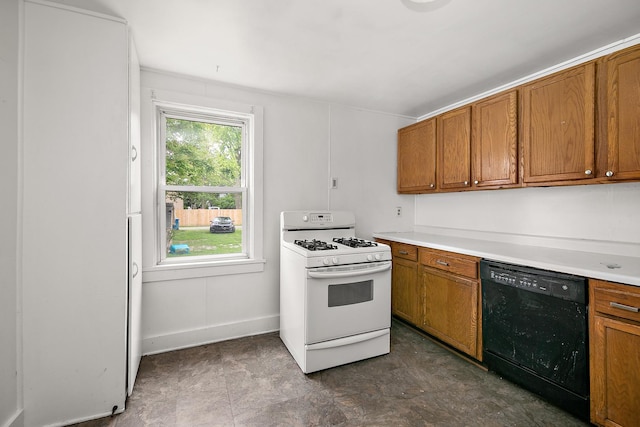 554 W Station St, Kankakee, IL 60901 - kitchen featuring black dishwasher, white gas range, and brown cabinetry