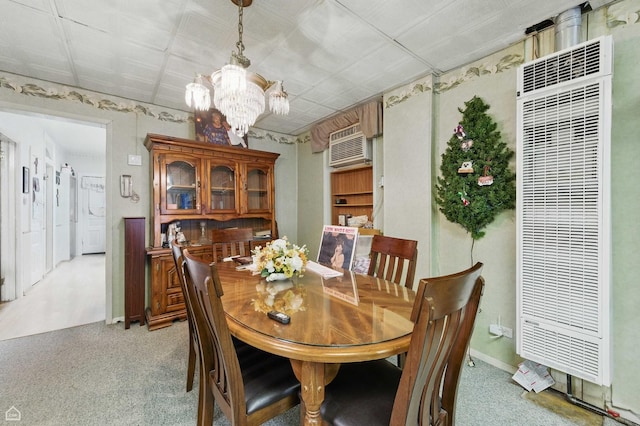 1448 W Taylor St, Chicago, IL 60607 - dining room featuring a heating unit, a chandelier, a wall mounted air conditioner, and light colored carpet