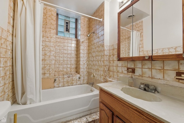 1448 W Taylor St, Chicago, IL 60607 - full bath featuring vanity, tile walls, and shower / bath combo with shower curtain