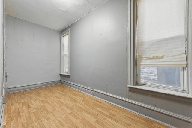 1448 W Taylor St, Chicago, IL 60607 - empty room featuring wood finished floors and plenty of natural light