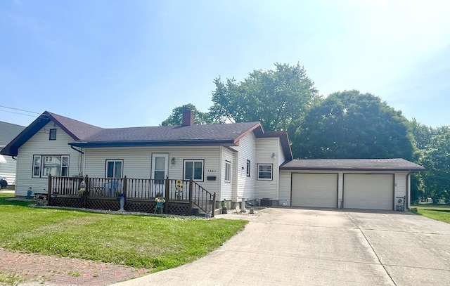 1660 Laharpe St, Lasalle, IL 61301 - ranch-style home with a chimney, a front lawn, an attached garage, concrete driveway, and a wooden deck