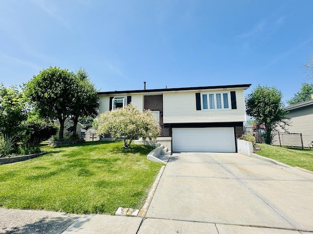 1015 Hastings Ln, Hanover Park, IL 60133 - raised ranch with an attached garage, concrete driveway, and brick siding