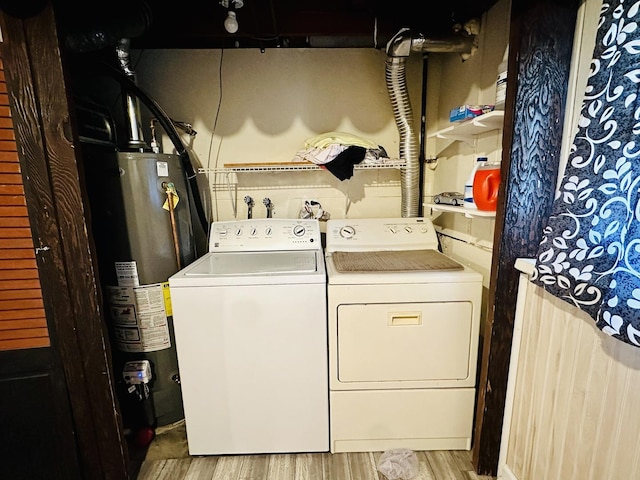 1015 Hastings Ln, Hanover Park, IL 60133 - laundry room featuring washer and clothes dryer, gas water heater, and wood finished floors