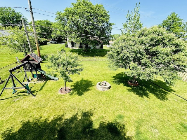 1015 Hastings Ln, Hanover Park, IL 60133 - view of grassy yard with a playground